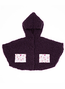Cape with fabric pockets