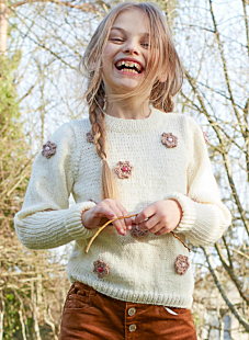 Sweater with crochet flowers