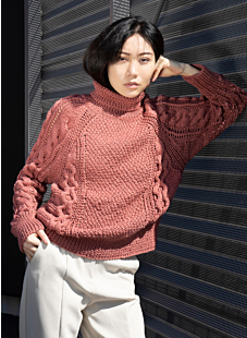 Raglan sweater with lacy cables