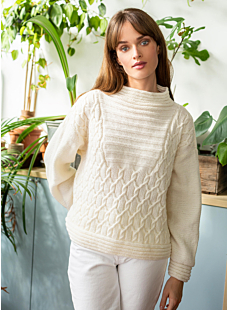 Cabled sweater with textured panel